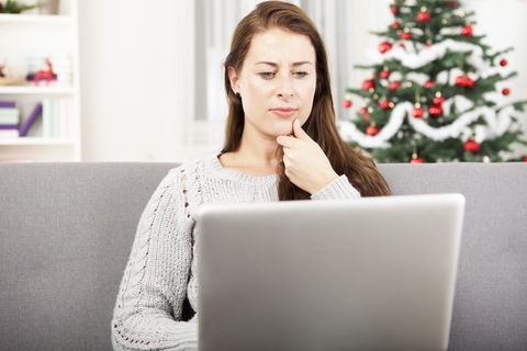 Woman Trading On Computer Over Christmas